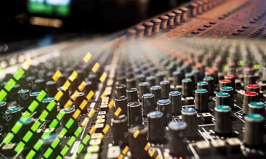 Close-up of an audio mixing console